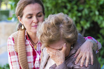 hourglass older person being comforted